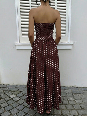 Brown polka dot maxi dress with smocked bodice and A-line skirt.
