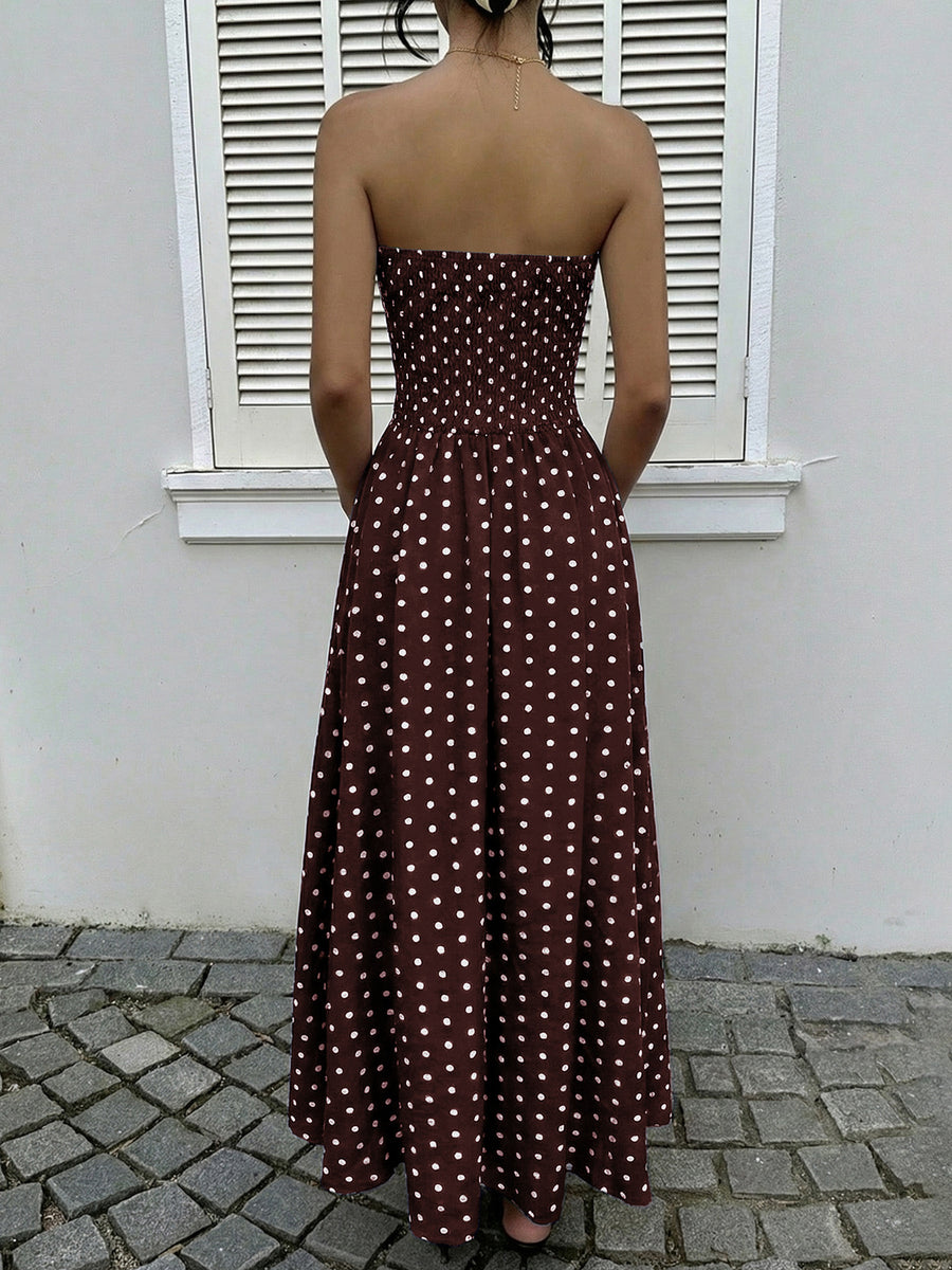 Brown polka dot maxi dress with smocked bodice and A-line skirt.