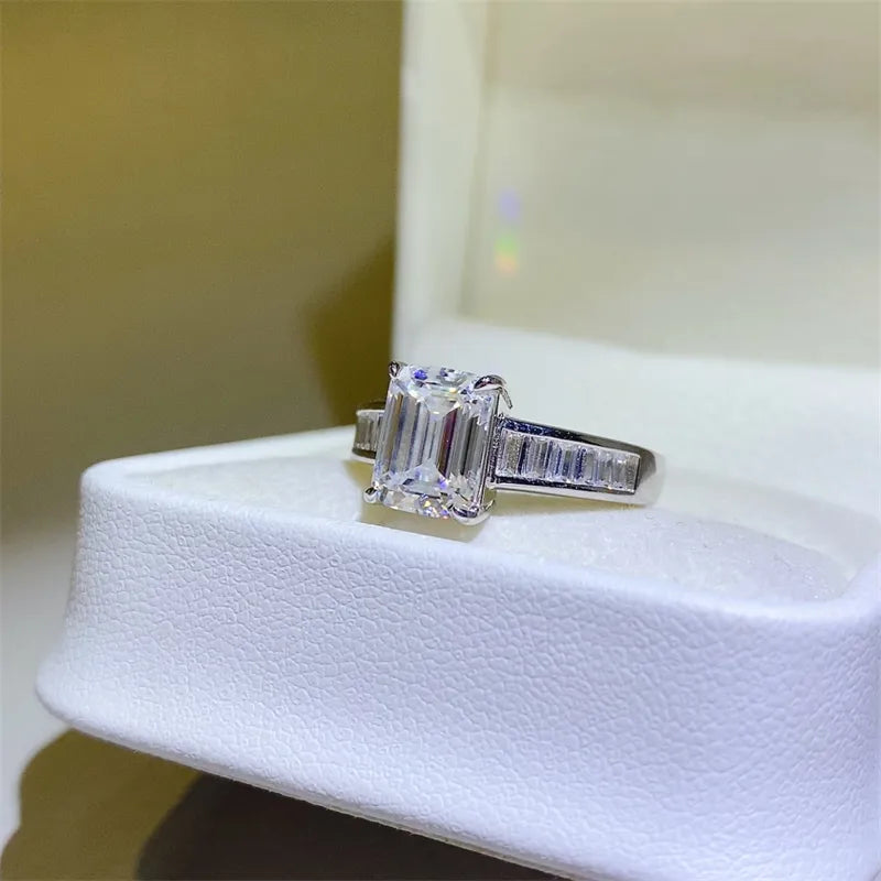 Emerald cut moissanite ring with baguette accents in silver sterling 925