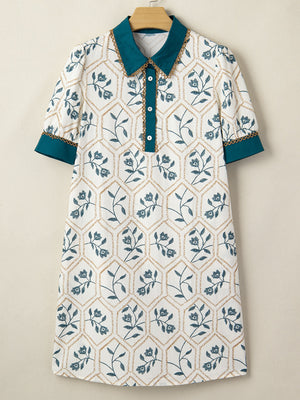 Floral print polo collar mini dress with button detail and contrast trim.