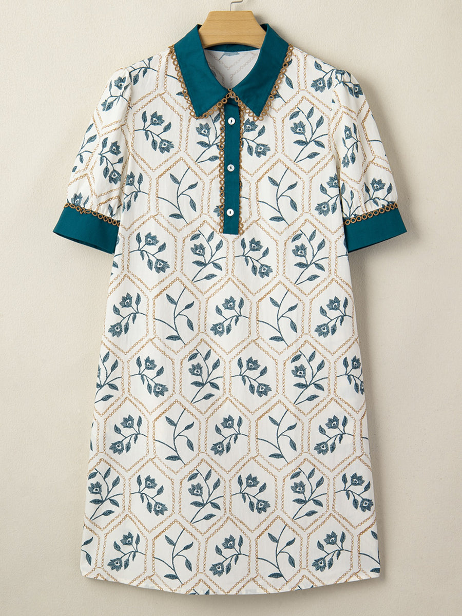 Floral print polo collar mini dress with button detail and contrast trim.