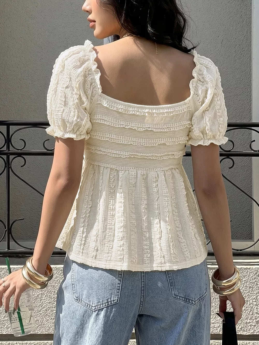 Cream textured maternity t-shirt with puff sleeves and smocked bodice.