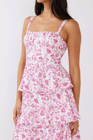 Tiered mini dress with pink floral print, square neckline, and smocked bodice.