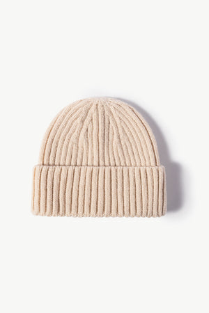 Chunky ribbed knit beanie in cream acrylic with a cuffed hem.