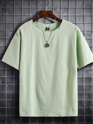 Light green cotton crew neck t-shirt with short sleeves and a relaxed fit.