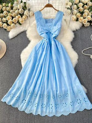 Blue eyelet maxi dress with cutout detail and smocked bodice