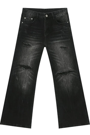 Distressed flare jeans in dark bleach wash denim with ripped details.