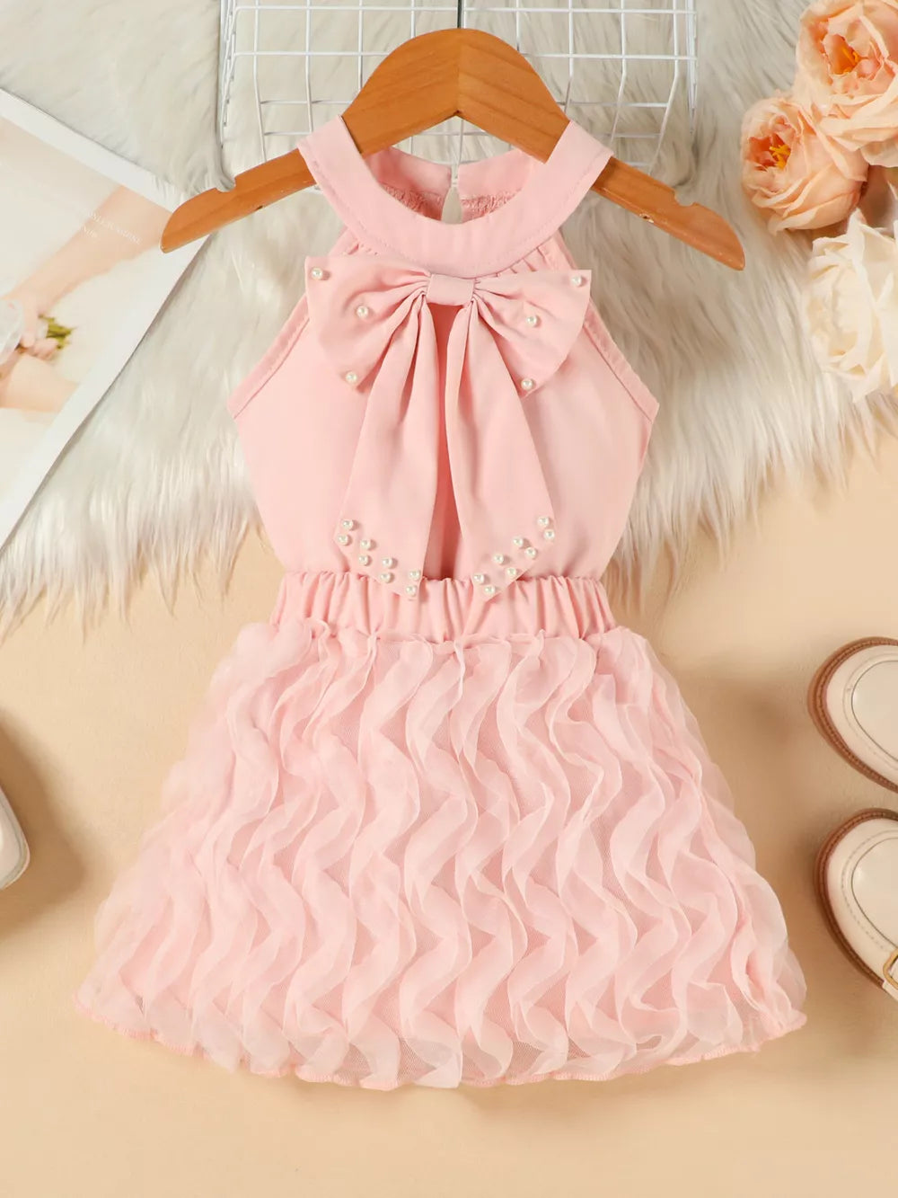 Pink toddler dress with pearl bowknot and ruffled skirt