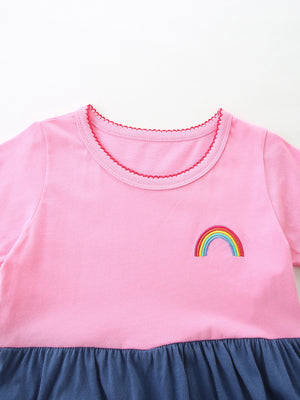 Pink toddler dress with rainbow embroidery and ruffled hem