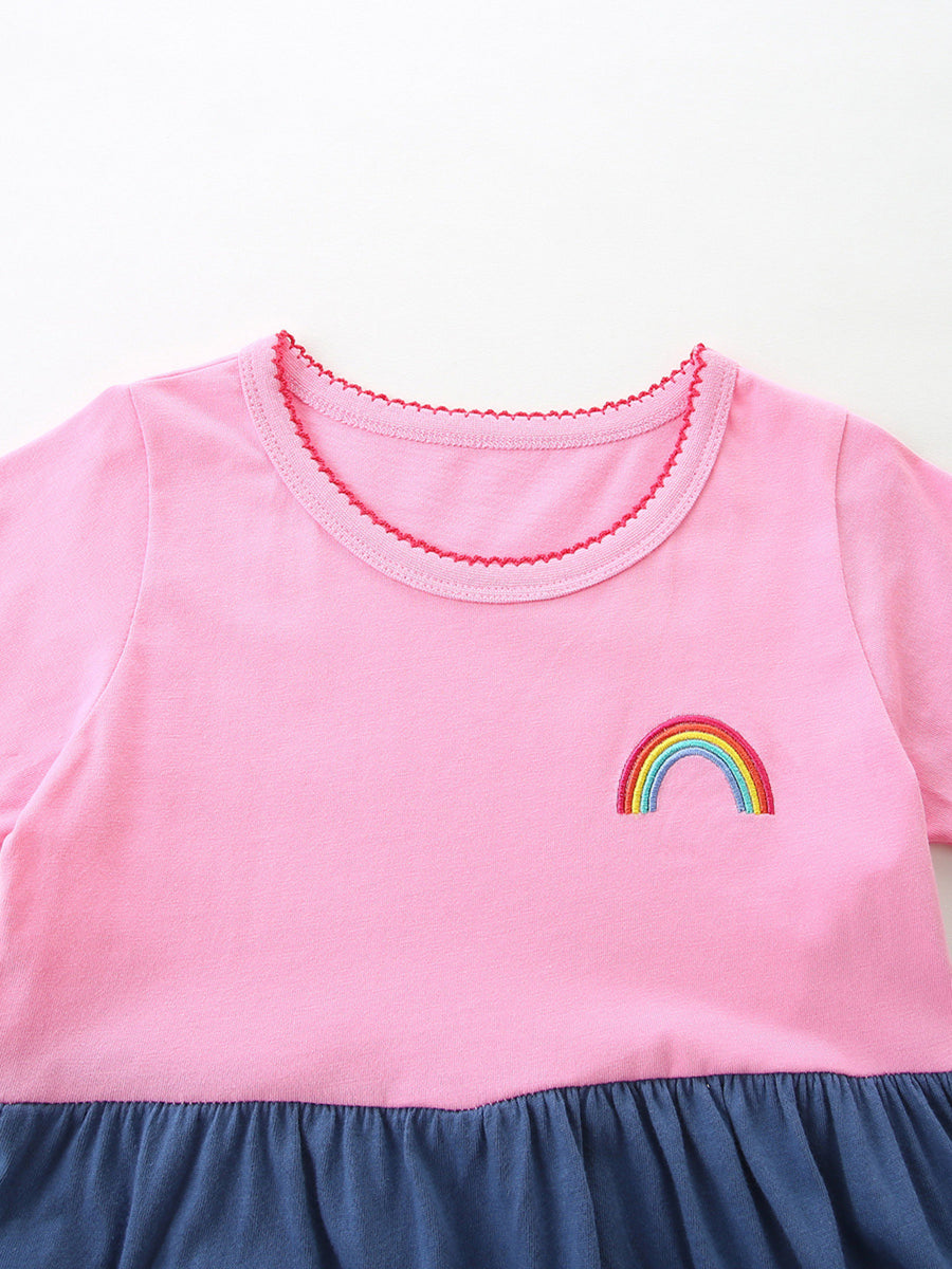 Pink toddler dress with rainbow embroidery and ruffled hem