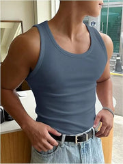 Men's ribbed tank top in dusty blue, body hugging fit with a crew neck.
