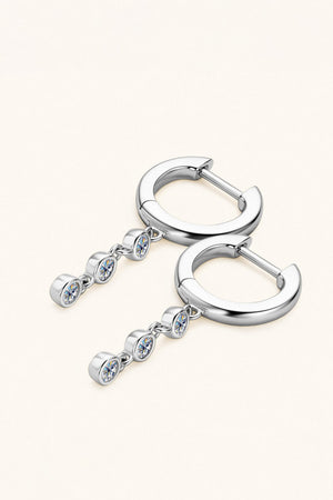 Silver hoop earrings with dangling gemstone accents