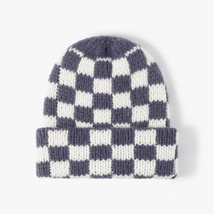 Checkerboard knit beanie in grey and white with a cuffed brim.