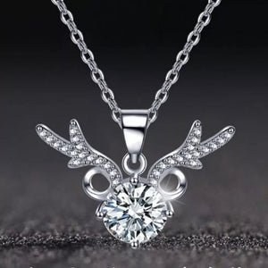 Sterling silver necklace with antler-inspired charm and a large moissanite stone.