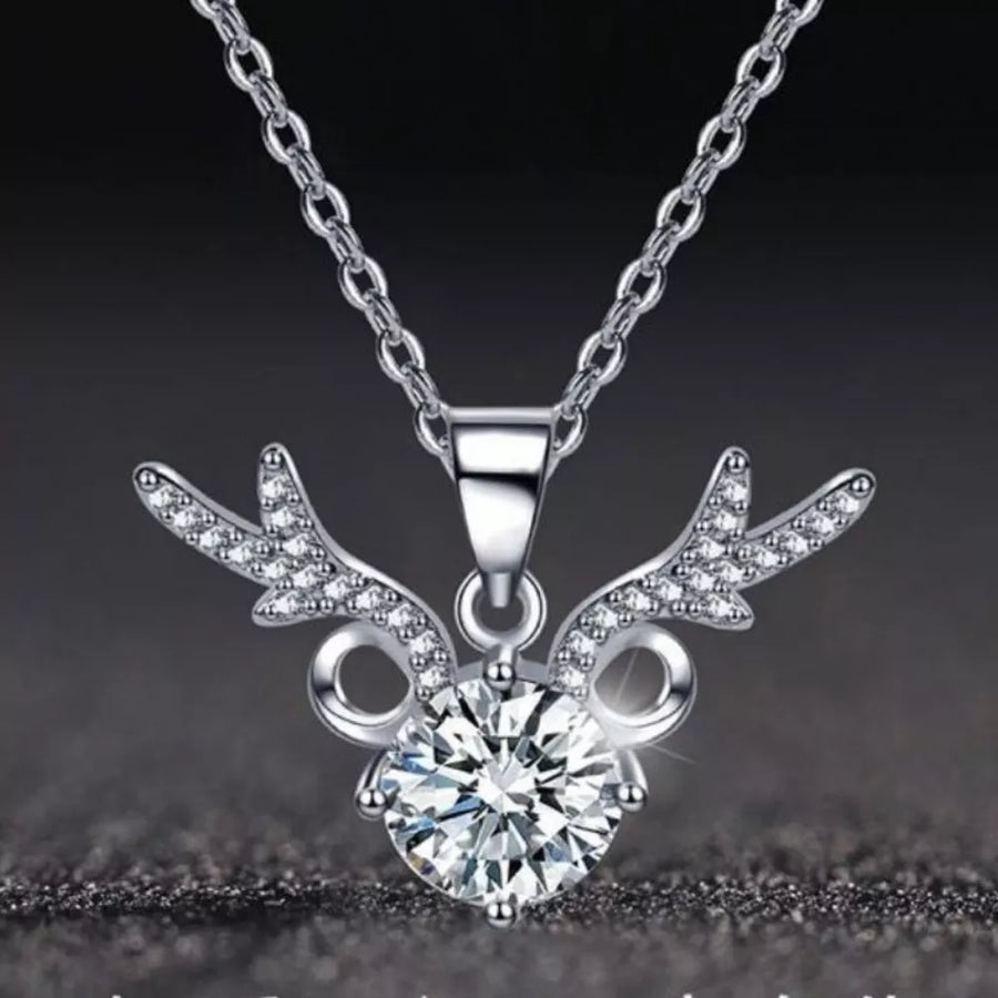 Sterling silver necklace with antler-inspired charm and a large moissanite stone.