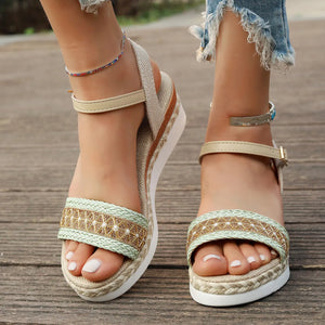 Beige embroidered espadrille platform sandals with braided jute detail and ankle strap.