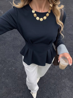 peplum top in navy blue featuring buttoned cuffs and fitted fit