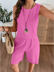 Fuchsia pink relaxed fit tank and shorts set with round neckline and elastic waist shorts.