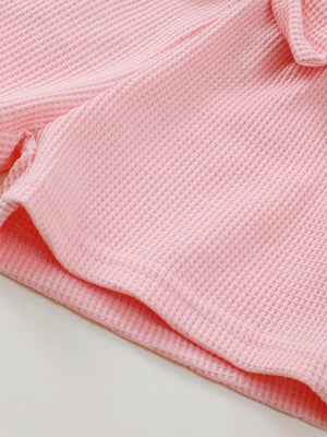 Pink waffle knit tank and bow shorts set detail.