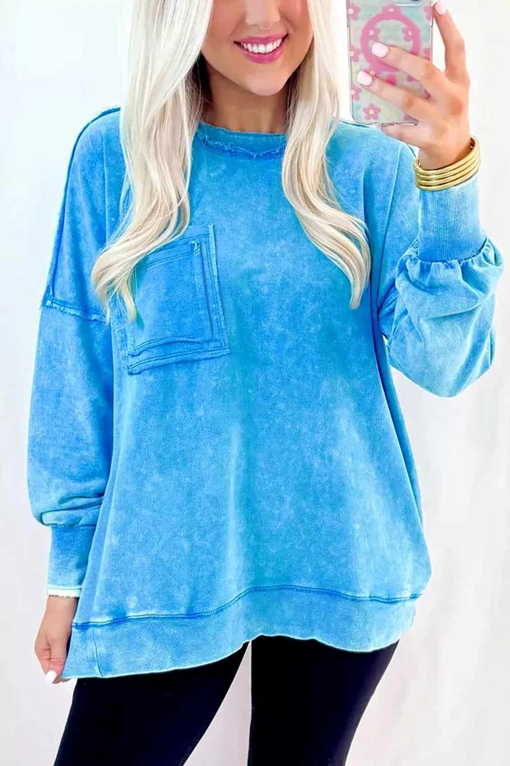 sweatshirt in aqua blue featuring chest pocket and oversized fit