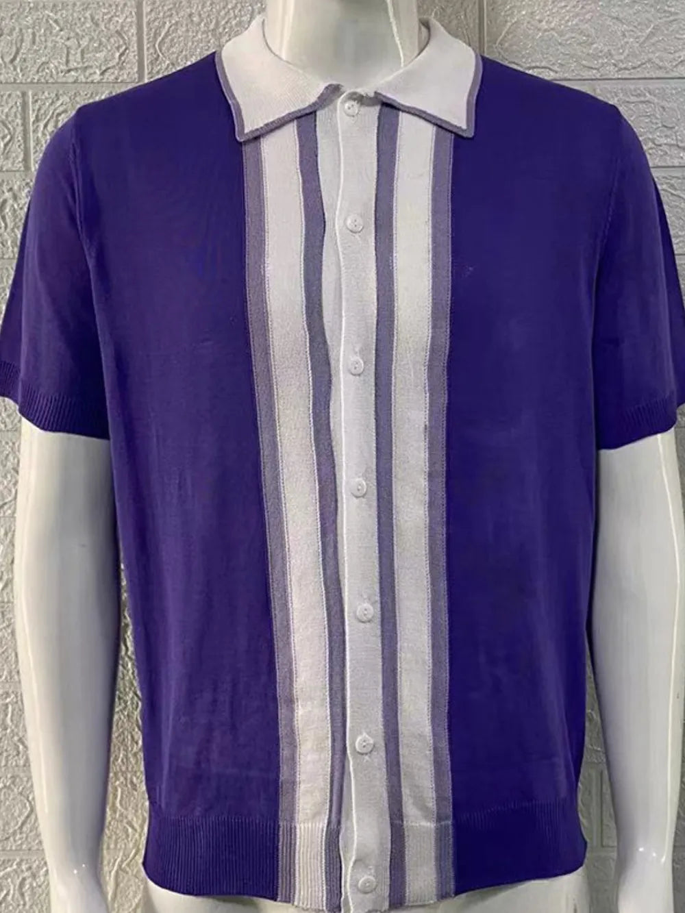 Violet acrylic knitted polo shirt with vertical white and grey stripes and a white collar.