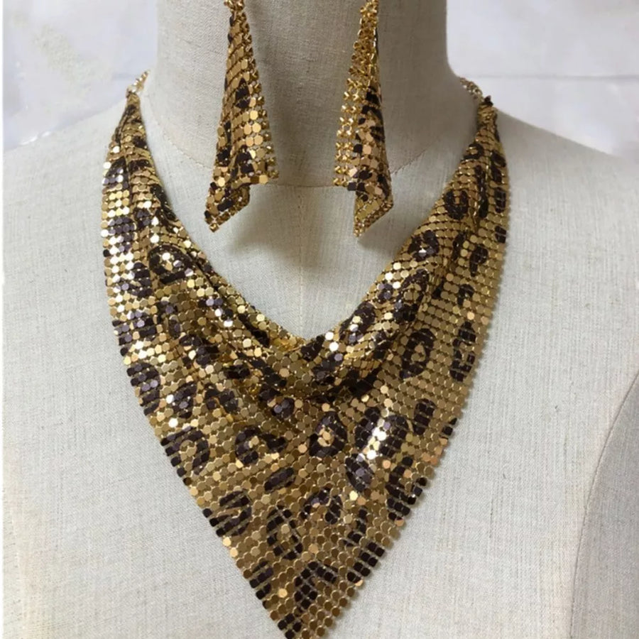 gold jewelry set with choker length necklace, long drop earrings and hook-and-eye, clasp