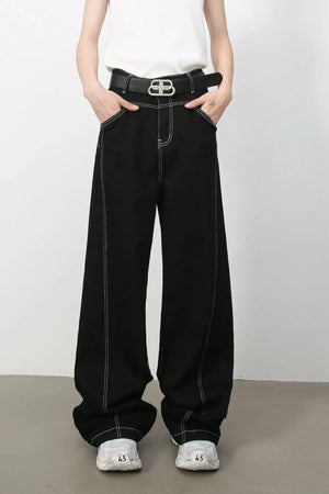 Black relaxed fit denim jeans with contrast stitching and a wide leg.