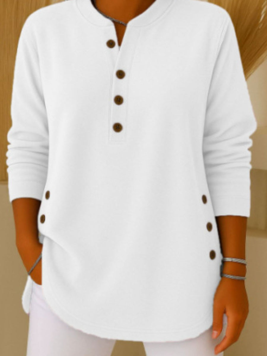Green henley with decorative side buttons and long sleeve