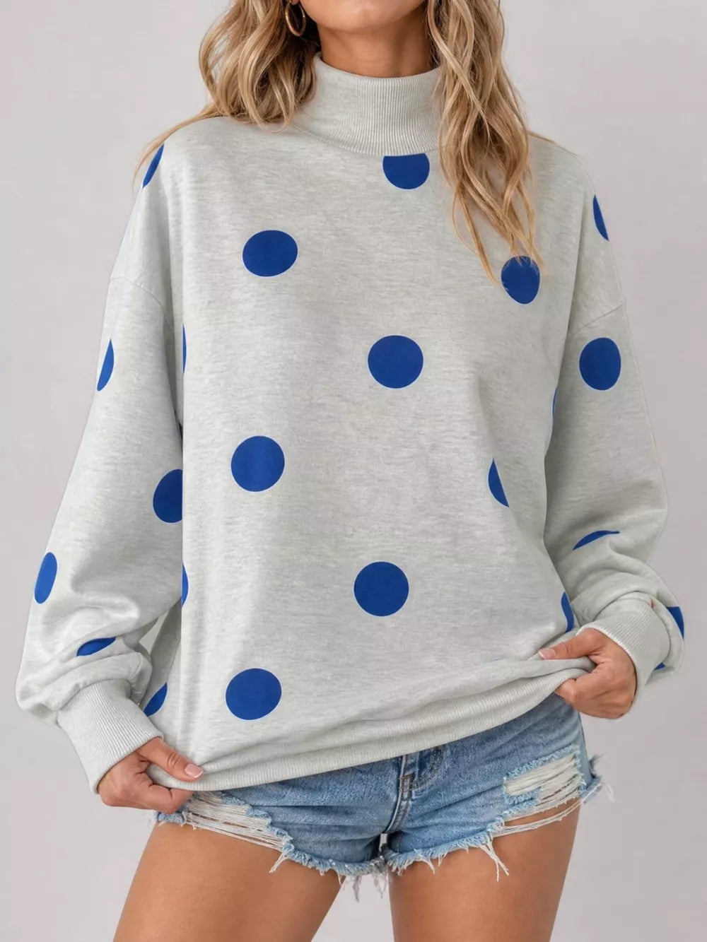 royal blue sweatshirt featuring stretch and polka dot