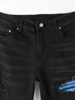 Black distressed denim jeans with azure underlay detail