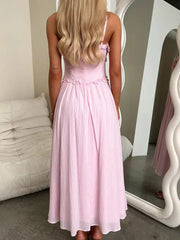 Pink midi dress with spaghetti straps and ruffled details, a-line cut