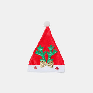 Red party hat with green glitter antlers, gold bow, and snowflake trim