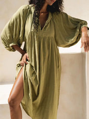 Matcha midi dress with tie-neck, V-neck, and voluminous puff sleeves.