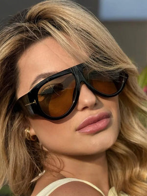 sunglasses in black featuring UV400 protection and oversized fit