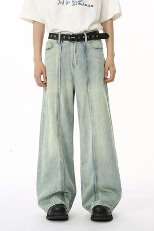 Light wash seamed palazzo denim trousers with a wide leg and casual styling.