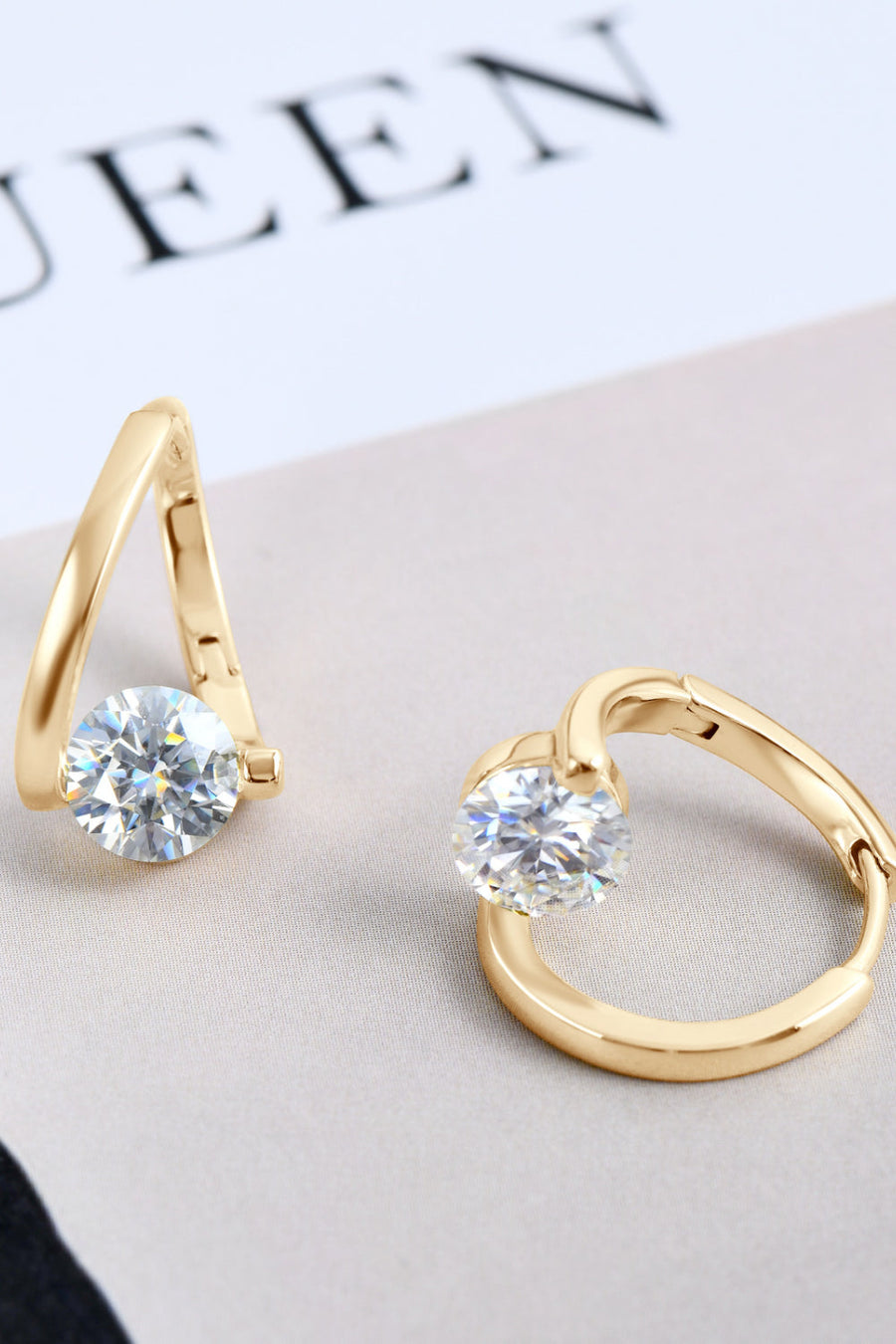Gold hoop earrings with single round clear cubic zirconia stones