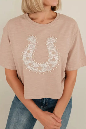 Beige cotton crew neck tee with horseshoe lace and pearl accent