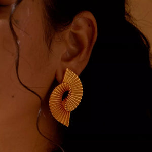 Gold earrings featuring gold-plated and geometric
