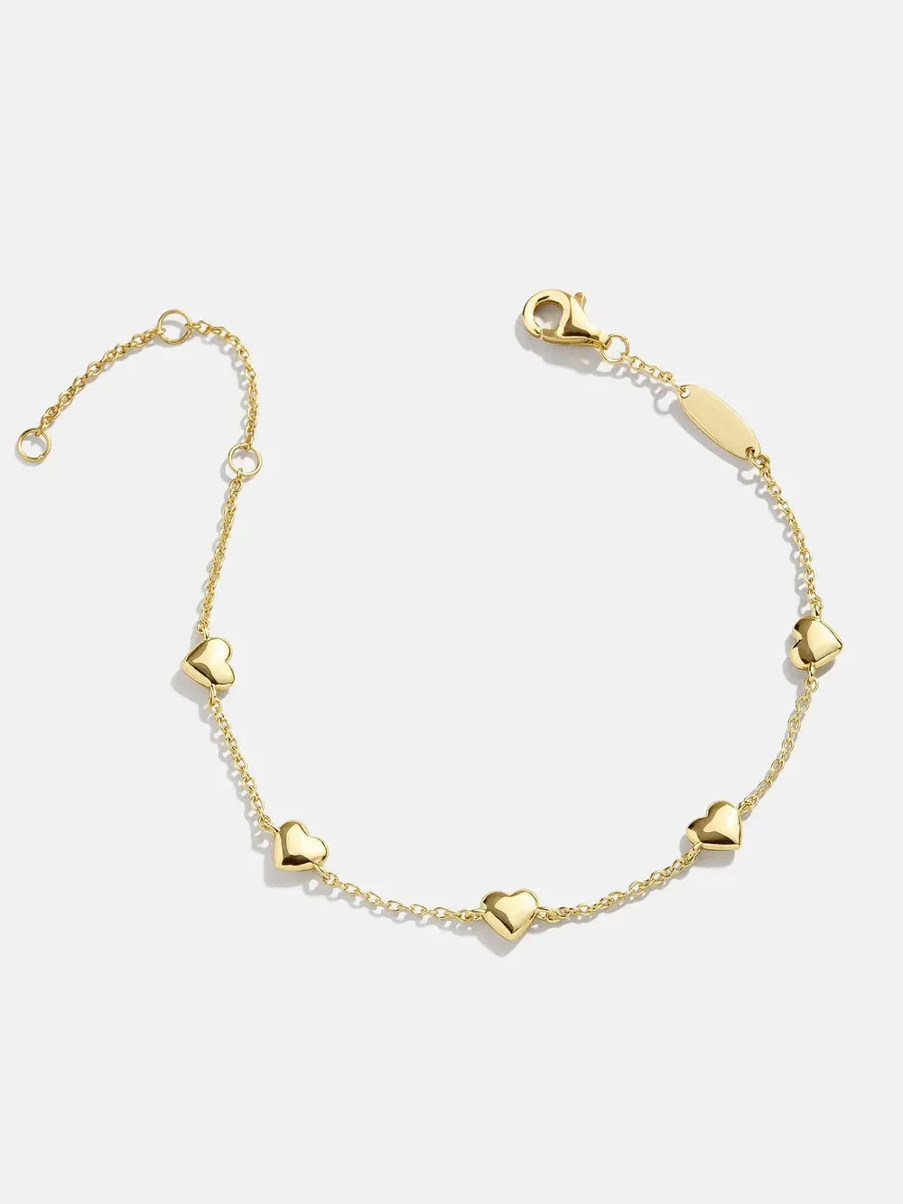 Gold chain bracelet with multiple heart charms