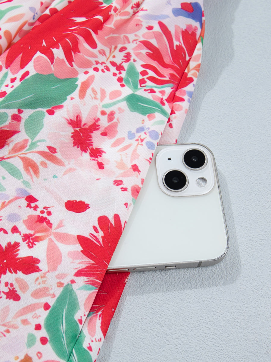 Floral print midi dress with tie shoulders, featuring a vibrant red and pink floral pattern.