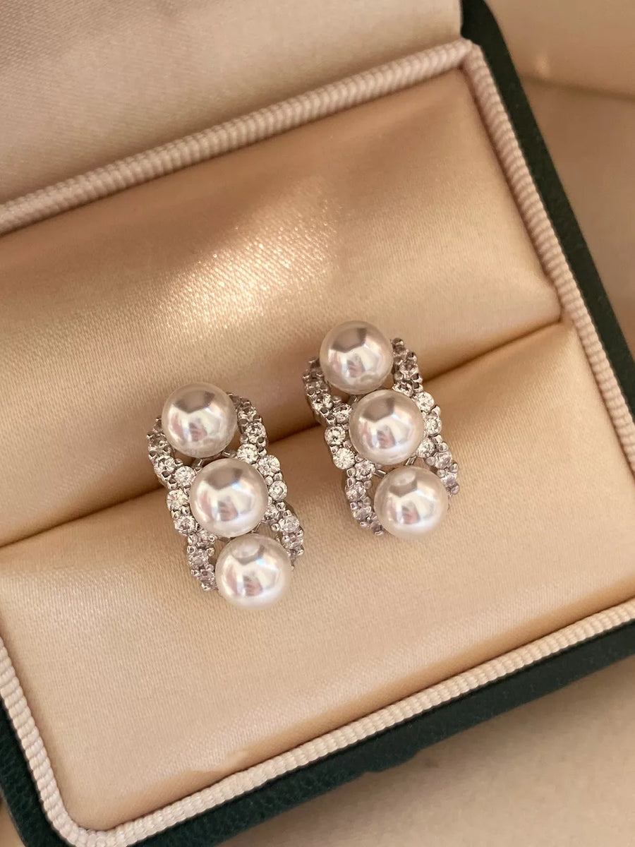 earrings in white featuring pearl embellishment and linear fit