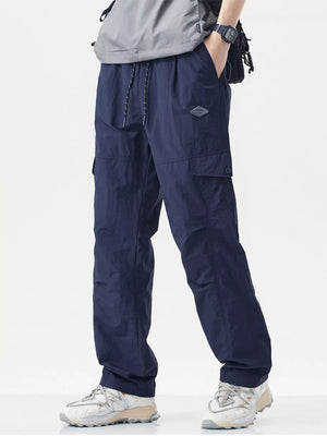 Navy blue relaxed fit cargo sweatpants with drawstring and patch detail.