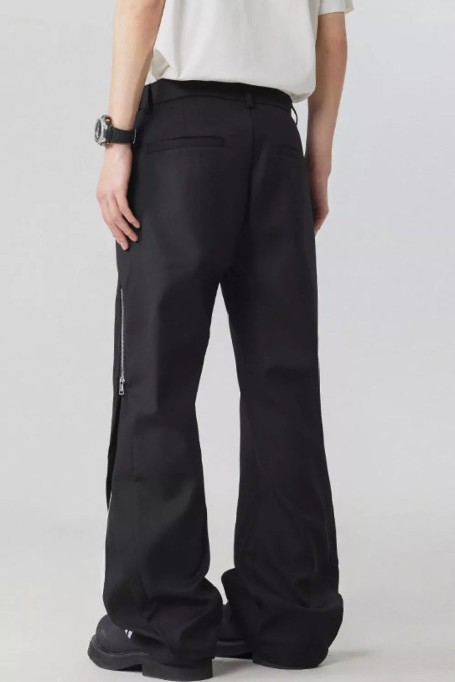 Black wide-leg sweatpants with side zipper detail and drawstring waist.
