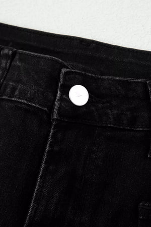 Black high-waisted cropped jeans with a button closure and raw hem detail.
