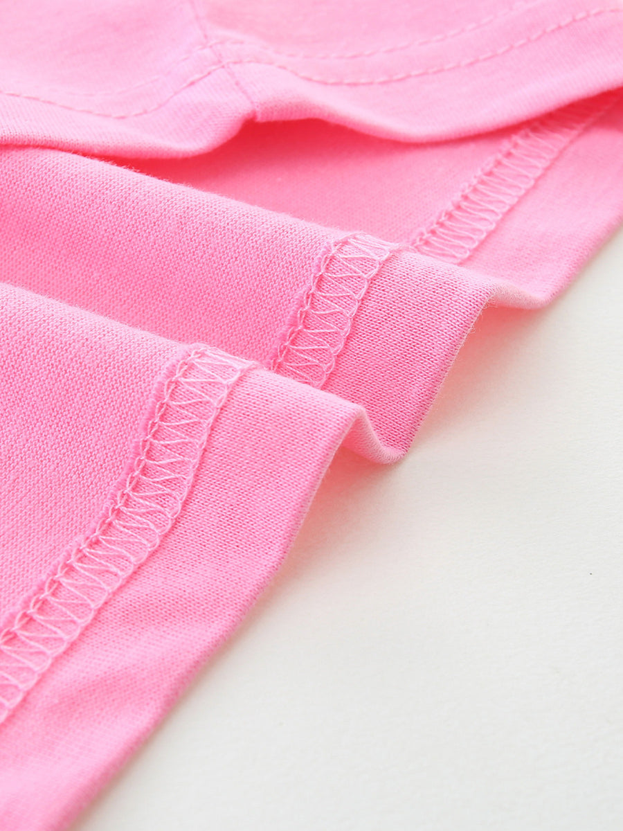 Pink cotton t-shirt detail showing double-stitched hem and seams.