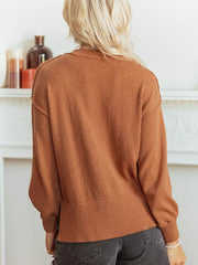 100% polyester Care instructions: Machine wash cold pullover sweater in rust with oversized silhouette