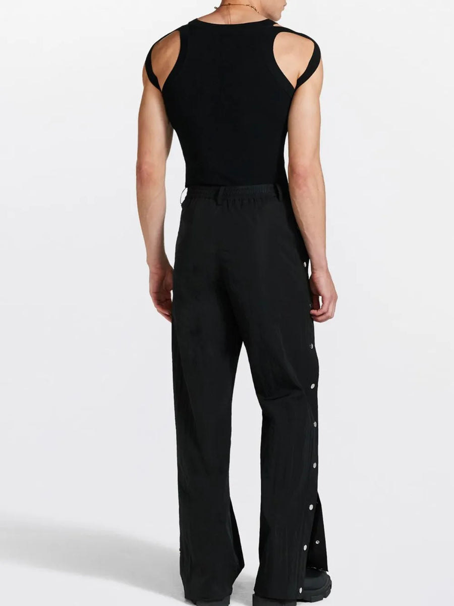 Black tank top with sculpted shoulder straps and a crew neck.