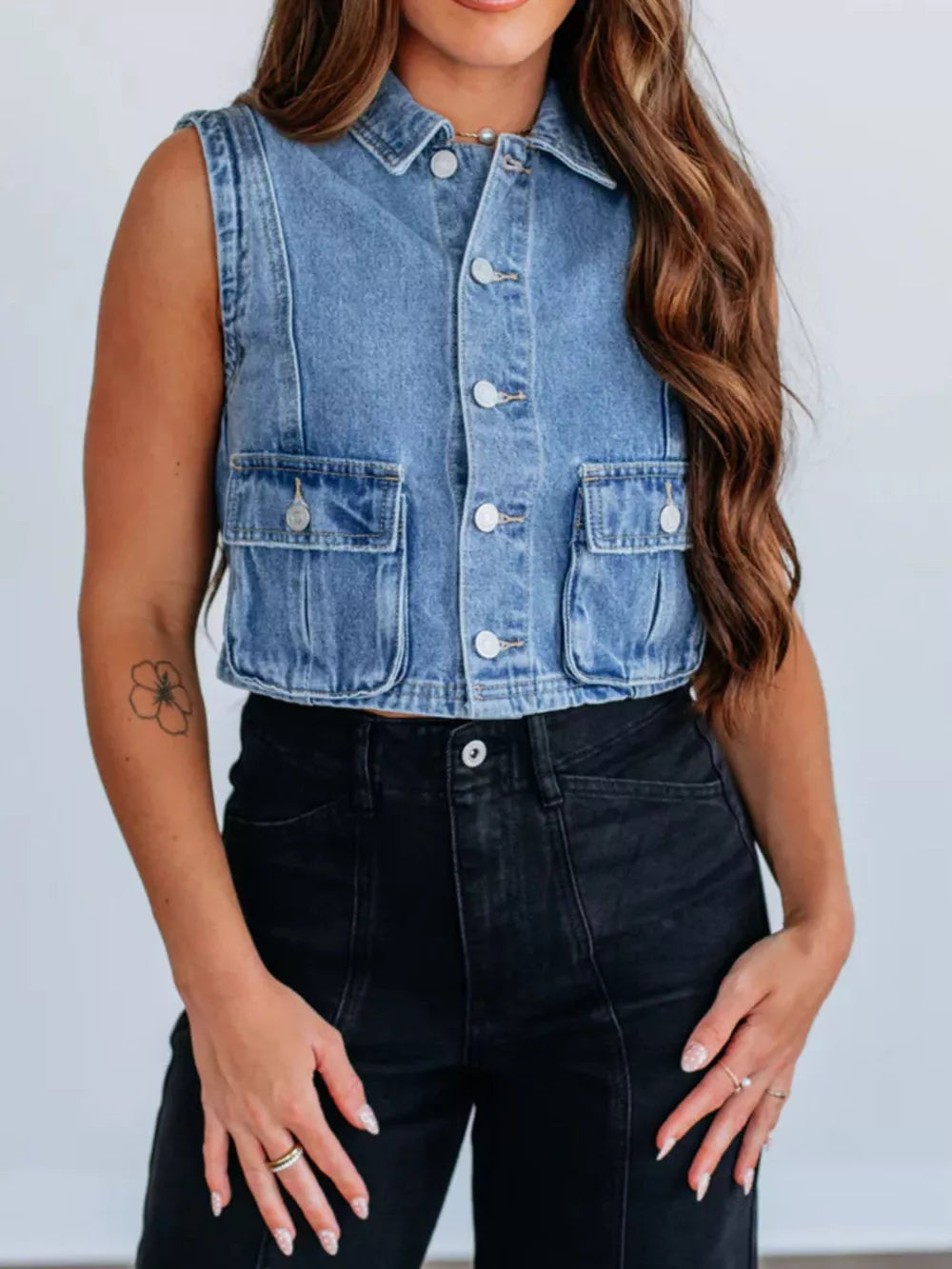 vest in medium blue featuring button-front and boxy fit
