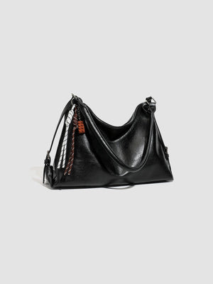 black with shoulder bag with decorative charm