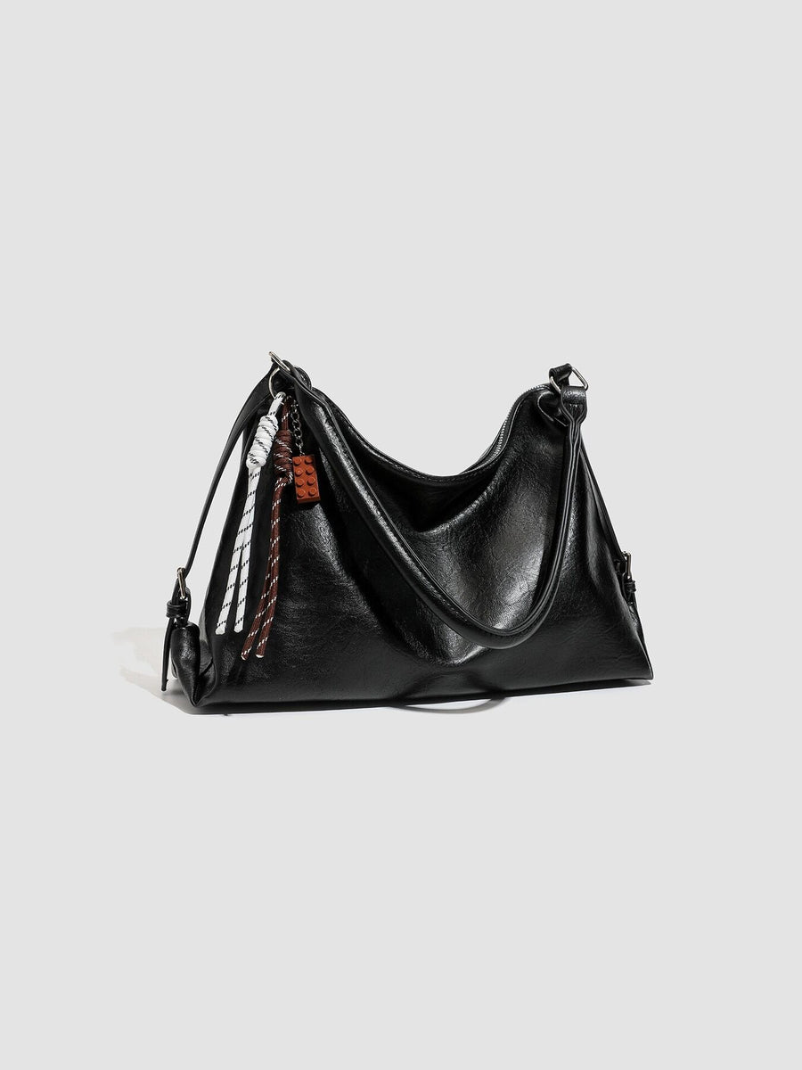 black with shoulder bag with decorative charm